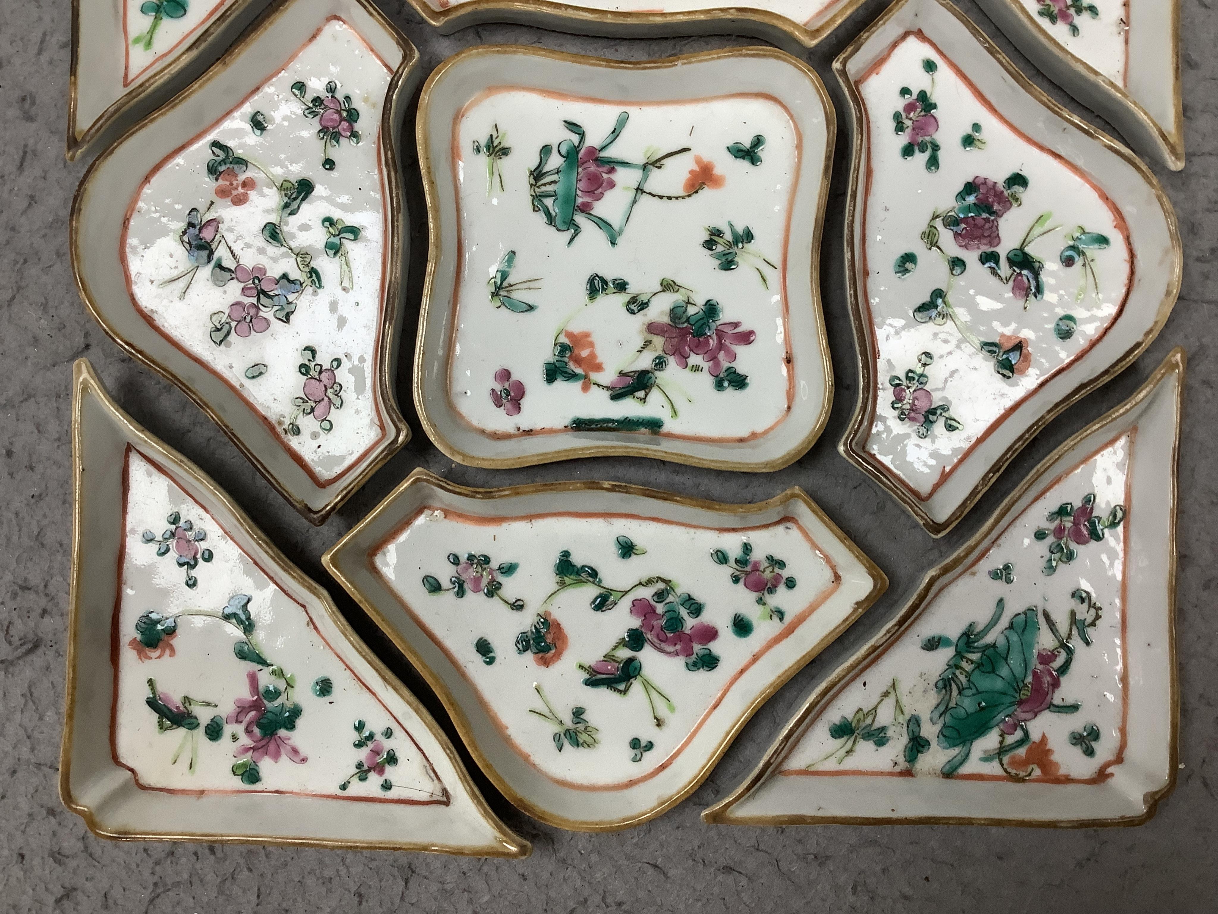 A square Chinese hardwood tray of famille rose geometric dishes, 30cm. Condition - fair to good